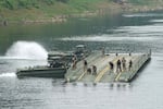 U.S. Army soldiers try to dismantle a floating bridge during a training exercise on a river in Yeoncheon, South Korea, near the border with North Korea, Thursday, Aug. 20, 2026.