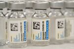 A close up view of numerous vials, each labeled "Janssen COVID vaccine 5 doses of 0.5 mL"