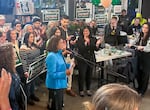 Susheela Jayapal acknowledges the election results were disappointing, as she speaks to her supporters on election night at Migration Brewing in North Portland, Ore., May 21, 2024. Her sister, U.S. Rep. Pramila Jayapal, right, center, in black, looks on. Susheela Jayapal came up short in the Democratic primary for Oregon’s 3rd Congressional District. 