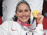 Bird poses with her gold medal at the Tokyo 2020 Olympic Games last August.