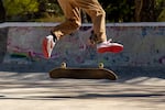 Francisco Pedraza Padilla Jr., 15, does a kick flip trick during an afternoon skating session with his friends. The three young men practice different tricks at the skatepark at least three times a week.