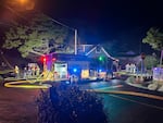 A North Lincoln Fire and Rescue truck outside a house that caught on a fire in Lincoln City, Ore. A suspect barricaded himself in the house early morning on Sept. 5, 2024, after shooting at Lincoln City police officers.