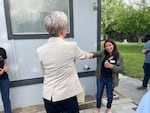 Gov. Tina Kotek fist bumps Oregon Rural Action organizer Ana Maria Rodriguez while visitng her home in Boardman on May 3 to learn more about nitrate contamination and how its impacting residents.