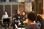 Grant High School teacher Courtney Palmer (far left) and St. Mary's Academy senior Karen Reyes speak to "Think Out Loud" host Dave Miller.