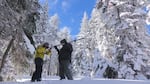 Ben Thorpe (left) and Shavon Haynes measure the snowpack on Mount Ashland.