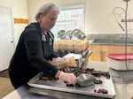 JoAnn King packages chocolate covered hazelnuts at the production facility at King Family Hazelnuts in Silverton, Ore on Oct. 29, 2025.