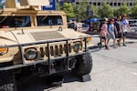A military Humvee is parked near one of the spectator entrances to the The Freedom 250 Grand Prix.