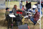 Members of the Clark County Amateur Radio Club, meet to set up emergency transmitters in Vancouver, Wash., June 27, 2026.