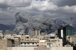 Smoke rises after a series of explosions in Tehran, Iran on March 01, 2026.
