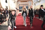 Barry Adelman, from left, Nikki Glaser, Helen Hoehne, and Glenn Weiss roll out the red carpet during the 82nd Golden Globes press preview on Thursday, Jan. 2, 2025, at the Beverly Hilton in Beverly Hills, Calif.