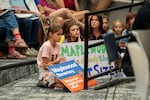 Portland Public Schools students listen to public comment during the meeting.