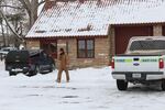 The unidentified militant seen here drove the federally-owned vehicle on the right while at the Malheur National Wildlife Refuge. He left the area after being photographed.