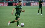 Portland Timbers midfielder Sebastian Blanco brings the ball up the pitch during the second half of an MLS soccer match against the Minnesota United in Portland, Ore., Sunday, Nov. 21, 2021.