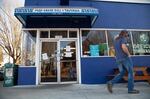 Signs on the windows of the Mad Greek Deli & Tavern stating they are open for takeout in Portland, Oregon. On Monday, March 16, 2020, Gov. Kate Brown ordered restaurants and bars to stop all on-site dining and limit food sales to takeout and delivery service only to help prevent the spread of the new coronavirus.