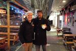 Portland transportation department spokesman Dylan Rivera, left, talks about the benefits of street patios with Eli Johnson, the owner of Dots Cafe.