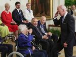 Biden salutes retired Air Force Brig. Gen. Wilma Vaught, one of the most decorated women in U.S. military history, after awarding her with the Medal of Freedom.