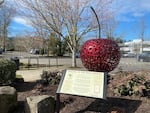 A red, steel sculpture of the Bing cherry outside the old city hall building in Milwaukie, Ore. The plaque remembers the legacy of Ah Bing, the Chinese-born immigrant, cultivator and namesake for Oregon’s sweet cherry.