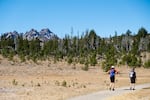 People hike the Tam McArthur Rim trail at the base of Broken Top outside Bend, Ore., Friday, Sept. 24, 2021.
