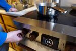 FILE - A resident boils water on an electric induction stove on Feb. 10, 2025, in New York. In eastern Oregon, the city of Ontario is asking residents to boil their water "vigorously" before drinking.