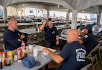 City of Arcadia Fire Department firefighters, who came in from the southern California city located in the Los Angeles area, talk while eating breakfast before they start their swing shift, from noon to midnight.