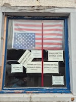 Anti-Trump signs in the window of a building in Stornoway, the biggest town on the Isle of Lewis, in Scotland's Outer Hebrides islands.