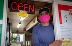 Fernando Rodriguez, owner of the Fernando’s Alegría food cart at the Portland Mercado in SE Portland, Ore., poses for a portrait from inside his cart on Wednesday, May 20, 2020. As a food cart, Fernando’s Alegría's business centered around takeout before the coronavirus pandemic.