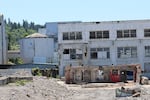 Crews worked to demolish buildings at the former Blue Heron Paper Mill on June 5, 2024. The Confederated Tribes of Grand Ronde are working to create tumwata village there, a mixture of public, cultural and commercial use overlooking Willamette Falls.
