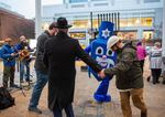 Rabbi Moshe Wilhelm, left, stands with a dreidel mascot at the first night of Hanukkah event put on by Chabad of Oregon at Director Park on Sunday, Dec. 22, 2019, in Portland, Ore.