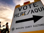 Voters walk to a polling station in Tempe, Ariz., in November 2020.