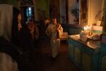 Parishioners attend a church service at an Orthodox church in the coal mining city of Pavlohrad, Ukraine, on Oct. 20.