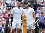Serbia's Novak Djokovic, left, and Spain's Carlos Alcaraz pose for a photo ahead of the final of the men's singles on day fourteen of the Wimbledon tennis championships in London, Sunday, July 16, 2023.