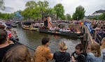 Tens of thousands of people watched as dozens of colorfully decorated boats toured the Dutch capital's historic canals Saturday, Aug. 5, 2023, in the most popular event of a six-day Pride Amsterdam festival that attracts tens of thousands of visitors to the city.
