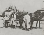 This image circa 1910 shows the Flowers family with a horse-drawn wagon.