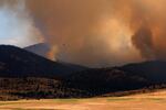 An attack plane monitors the fire's progress in Pine Creek on Wednesday, August 26.