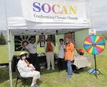 Southern Oregon Climate Action Now's Kathy Conway is at one of Rogue Valley's Earth Day events, where they educate people about climate action. 