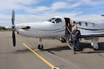 KinectAir CEO Jonathan Evans disembarks from a Pilatus PC-12 aircraft in Kalispell after joining a customer's flight from Vancouver, Washington.