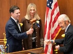 Oregon state Sen. Rob Wagner, D-Lake Oswego, left, is handed the gavel after being sworn in as Senate President, Jan 13, 2025, at the Oregon state Capitol in Salem, Ore.