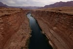 The Colorado River flows by the historic Navajo Bridge on June 23, 2021 in Marble Canyon, Ariz.