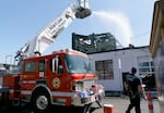 Portland Fire crews continue to put water on hot spots at the Portland Garment Factory at southeast 79th and Stark, where crews responded early morning on April 19, 2021 for a construction fire. No one was injured in the three-alarm blaze.