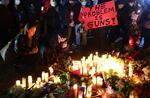 People attend a candlelight vigil for victims of a deadly mass shooting on Jan. 24 in Monterey Park, Calif. President Biden will announce his latest gun safety push there on Tuesday.