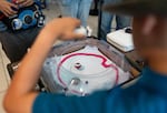 Jesus Acosta-Ware, right, battles with another attendee at the final Beyblade tournament held at the Lloyd Center shopping mall in Portland, Ore., on Aug 2, 2026. The tournaments will be moved to Gambit’s Games and BatCave Games after the Lloyd Center closes.