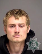 David Michael Dahlen, 24, escaped from Portland Police custody over the weekend. Police now say a cleaning crew opened the door where he was being held, but didn't close the door all the way.