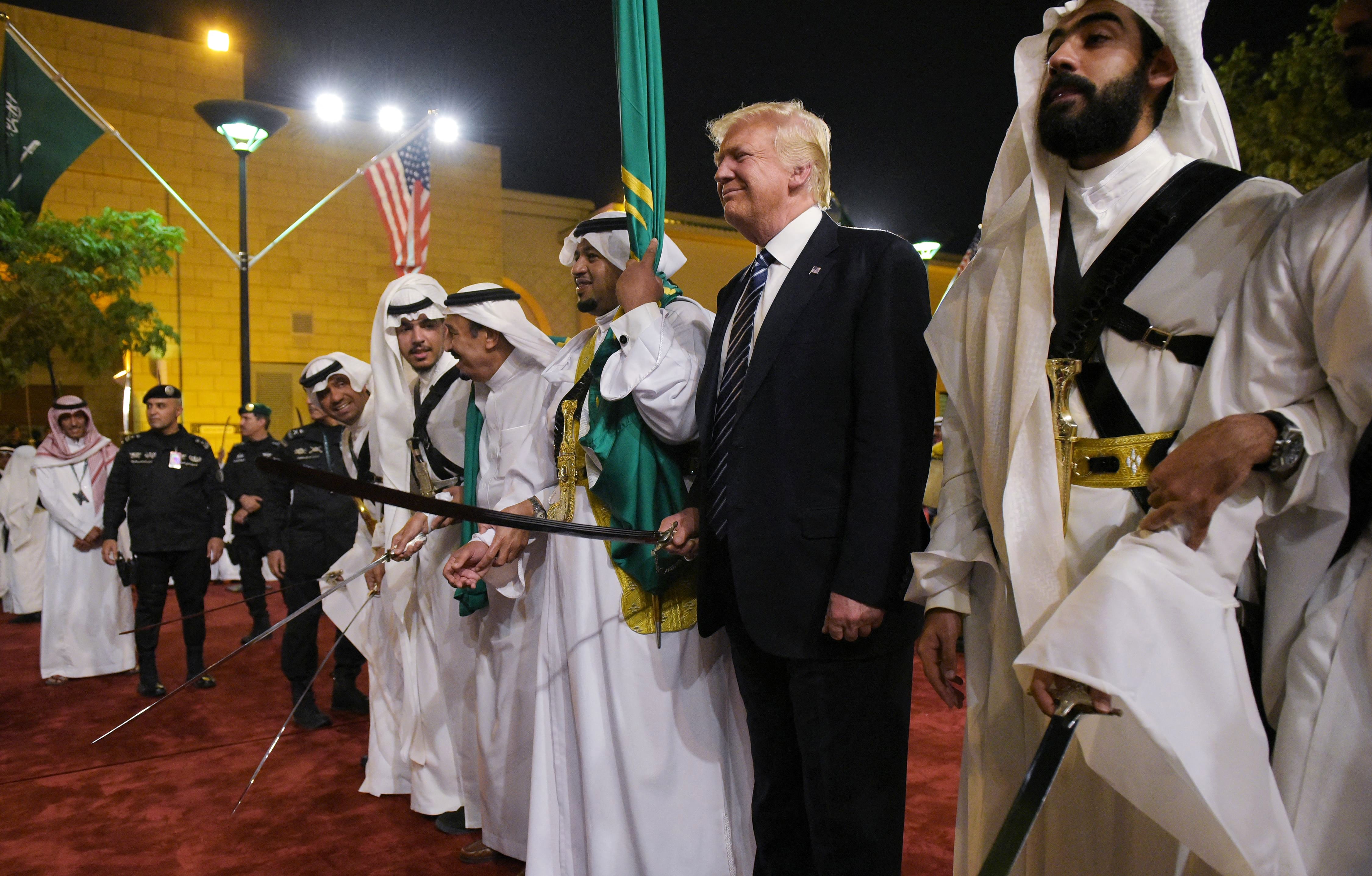 President Trump joins dancers with swords at a welcome ceremony in Riyadh, Saudi Arabia, on May 20, 2017.