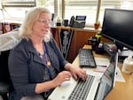 Kathleen Reid answers emails in her office at Benson Tech, Feb. 2, 2024. She has been working as a college counselor in Portland high schools for 11 years.
