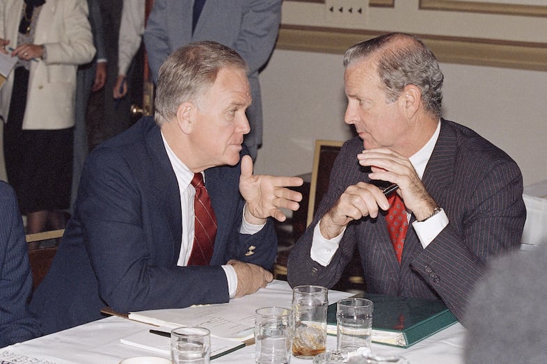 Treasury Secretary James Baker, right, huddles with Sen. Bob Packwood, R-Ore., on Capitol Hill in Washington, Monday, Nov. 2, 1987 during a session of administration and Congressional members working on the budget cuts.