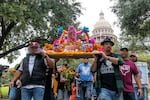 Día de Muertos altar for the 21 victims from the Robb Elementary School shooting being carried by the victims fathers from the Capitol to the Governor's Mansion, protesting for an age increase to purchase AR-15 and requesting everyone to vote. Full story here.