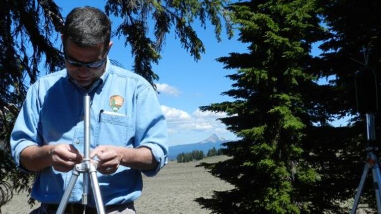 Chris Wayne adjusts a microphone stand. Scientists at Crater Lake National Park have recorded natural sound for a month at a time at 20 locations in the park.