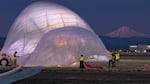 In this screen shot taken from an OPB video, the Near Space Corporation crew manages the upper portion of the high-altitude balloon at the Madras Airport., Nov. 21, 2021.