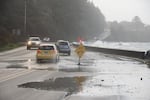 A king tide, timed with a storm, caused flooding along Highway 101 at the Waldport Seawall.