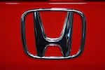 FILE - This is the Honda logo on a Honda Civic Sport Touring automobile on display at the Pittsburgh International Auto Show in Pittsburgh, Feb. 14, 2025.
